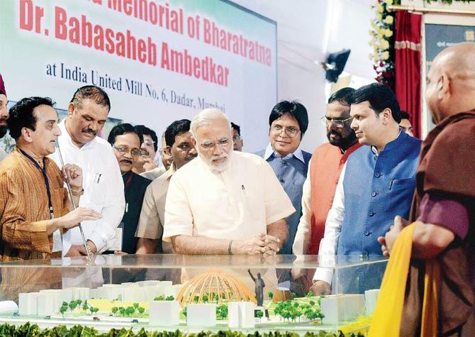 PM Narendra Modi and CM Devendra Fadnavis at Indu Mills on Sunday, where Modi laid the foundation stone for the Ambedkar memorial. Pic/PTI