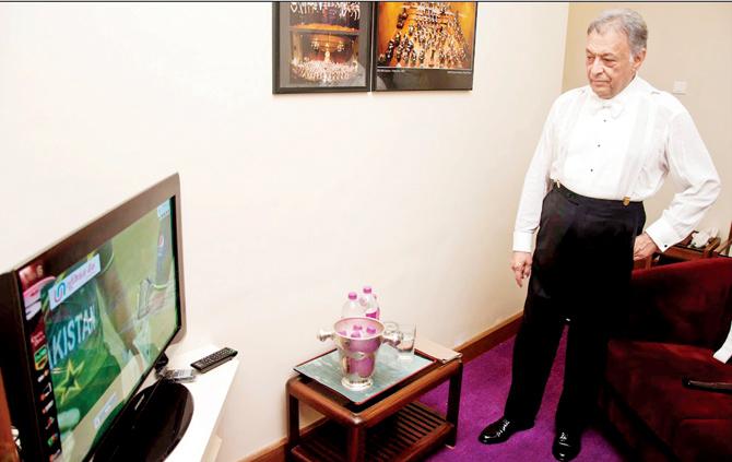 Photographer Harkiran Singh Bhasin captures a candid frame of Western Classical music conductor Zubin Mehta watching an India vs Pakistan cricket match backstage, during The Orchestra of the Maggio Musicale Fiorentino at Jamshed Bhabha Theatre, NCPA, on March 30, 2011. The maestro will perform in the city on October 25 and 26