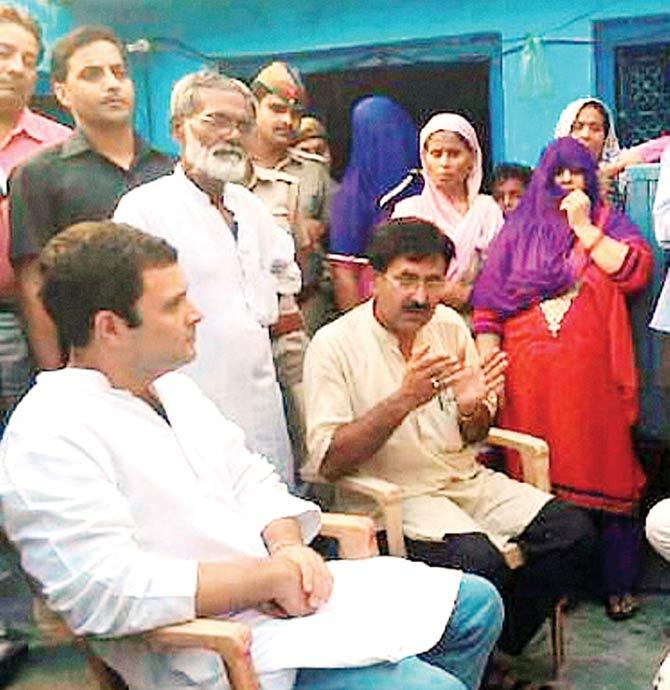 Rahul Gandhi meets the family of Mohammed Iqlakh, who was lynched by a mob, at Bisara village in Dadri. Pic/PTI