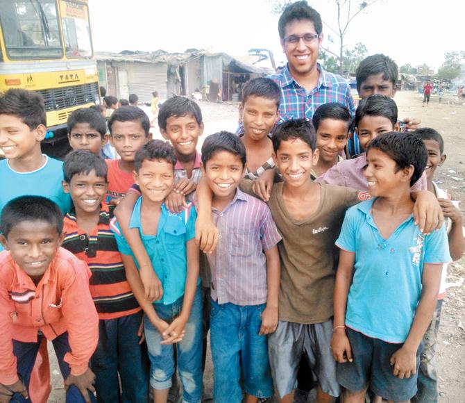WITH THE KIDS: Ratish Ramachandran (r) with the children he serves in his NGO
