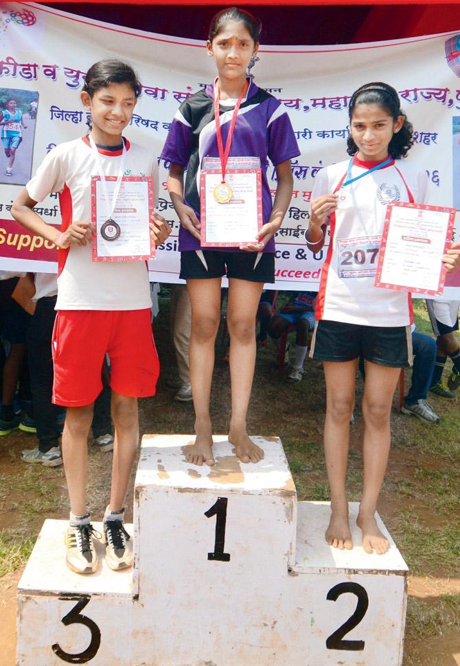 Sayali Mhaishune (centre) broke new ground against all odds at the District Sports Office inter-school athletic championships at Priyadarshini Park (PDP) last afternoon