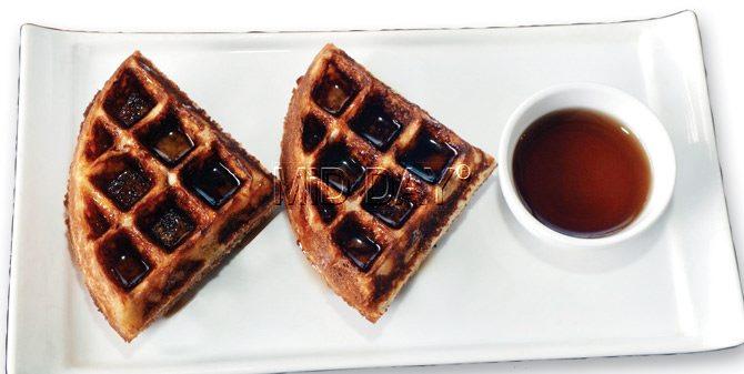 The Classic waffles with warm maple  sauce  makes for a good accompaniment for your cuppa