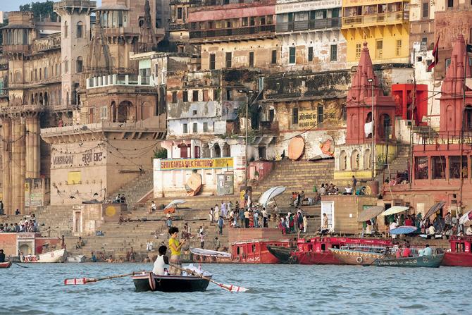 A tourist takes a boatride on the Ganga in Varanasi. Pic courtesy/ AFP