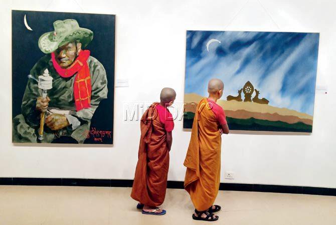 Young Buddhist monks at the exhibition. Pic/Atul Kamble