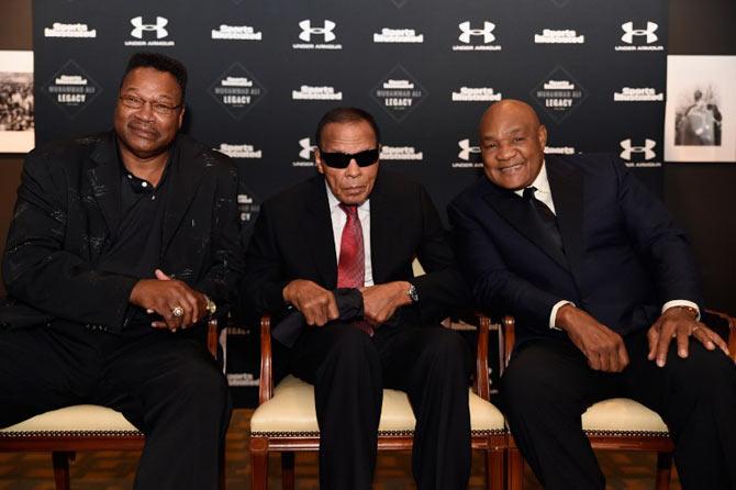 Larry Holmes, Muhammad Ali, and George Foreman attends the Sports Illustrated Tribute to Muhammad Ali at The Muhammad Ali Center on October 1, 2015 in Louisville, Kentucky.