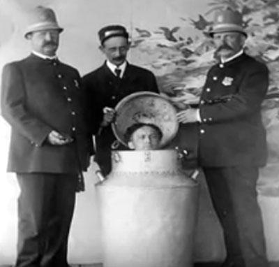 Harry Houdini being locked inside the milk can. Pic/YouTube