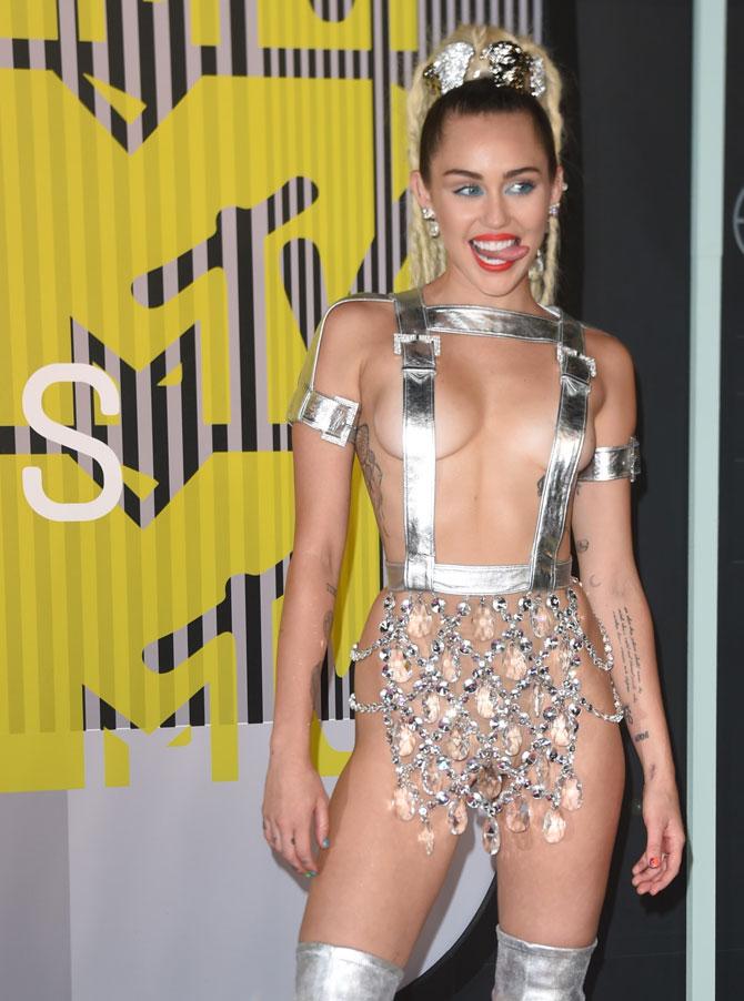 Miley Cyrus arrives on the red carpet at the MTV Video Music Awards at the Microsoft Theater in Los Angeles, California