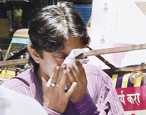 Following his helmeted first appearance, Sheena Bora’s father Siddharth Das chose to hide behind a handkerchief when he went to the Khar police station yesterday