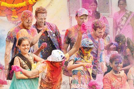 Coldplay shoots a video and plays Holi with kids in Worli