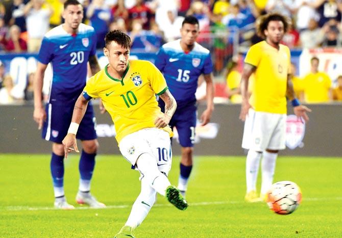 Brazil forward Neymar scores from the penalty spot during a friendly against the United States at Foxboro