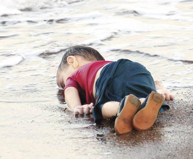 Aylan Kurdi’s body was photographed lying in the sand in Bodrum, Turkey after he drowned in a boat accident while his family tried to reach Greece. File Pic/AFP