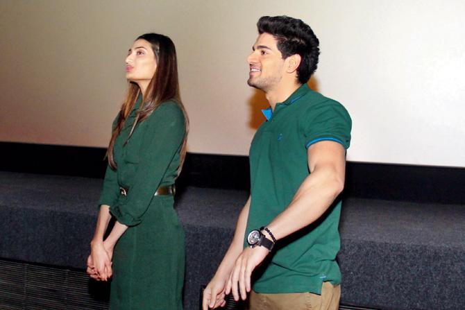 Athiya and Sooraj watching the movie