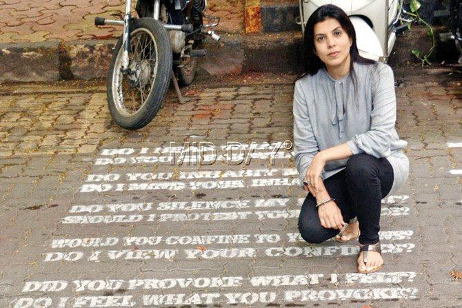 Artist Reena Saini Kallat sits beside Echoes on G Talwatkar Marg. PICS/DATTA KUMBHAR
