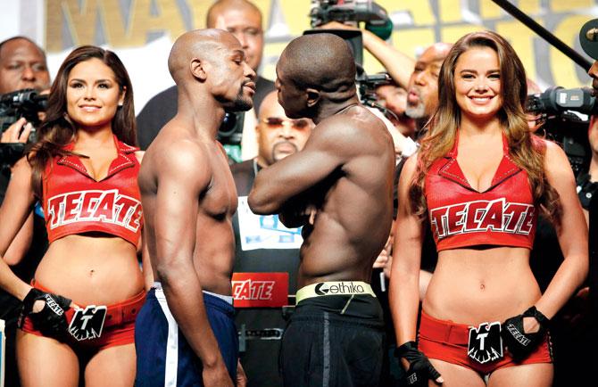 Floyd Mayweather (left) and Andre Berto face off during their official weigh-in at Las Vegas on Friday. Pic/AFP
