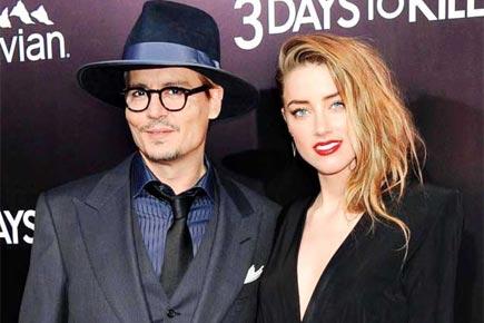 Dogged Johnny Depp ready to hit for Amber Heard