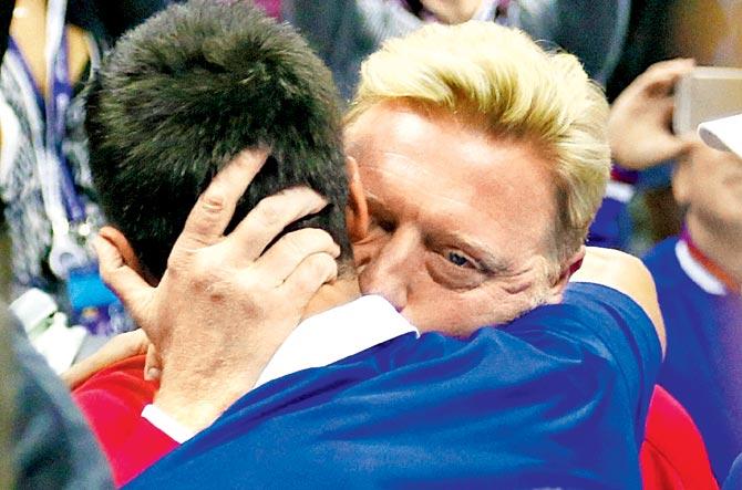 Novak Djokovic celebrates with his coach Boris Becker