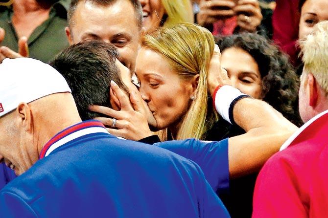 Novak Djokovic celebrates his victory by kissing his wife Jelena Djokovic. Pics/AFP