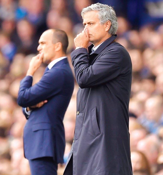 Chelsea boss Jose Mourinho (right) reacts as Everton’s Roberto Martinez looks on Saturday. Pic/Getty Images