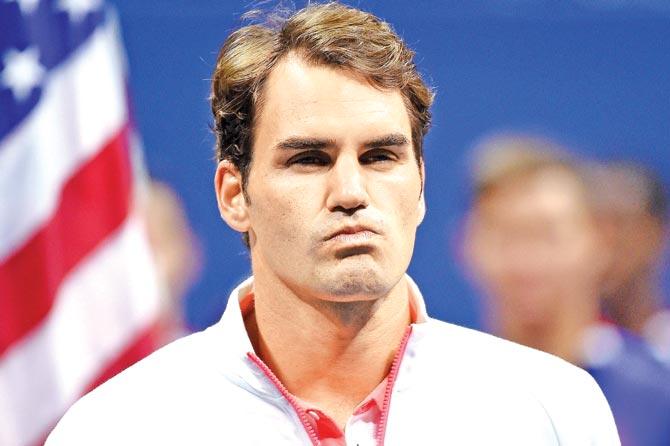 Roger Federer reacts during the US Open final presentation. Pic/AFP
