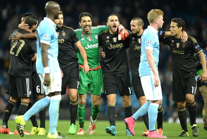 Juventus- goalkeeper from Italy Gianluigi Buffon C and Juventus- defender from Italy Leonardo Bonucci 3R celebrate after winning a UEFA Champions League group stage football match between Manchester City and Juventus at the Etihad stadium in Manchester. Pic/AFP