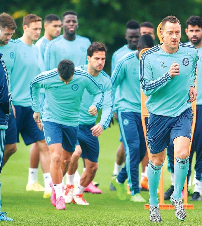 John Terry (right) warms up with Chelsea teammates ahead of their Champions League tie against Maccabi Tel Aviv in Cobham yesterday. Pic/Getty Images