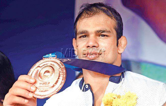 Narsingh Yadav shows off his bronze medal at a function at SAI