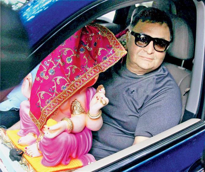 Rishi Kapoor (above) carrying Ganesha’s idol home on the eve of the festival