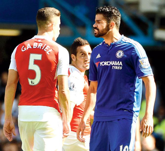 Diego Costa  (right) argues with Arsenal defender Gabriel Paulista. Pics/Getty Images