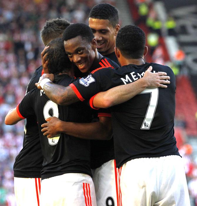 Manchester United-s French striker Anthony Martial C and teammates congratulate Manchester United-s Spanish midfielder Juan Mata L on scoring their third goal during the English Premier League football match between Southampton and Manchester United at St Mary-s Stadium in Southampton, southern England. Pic/AFP