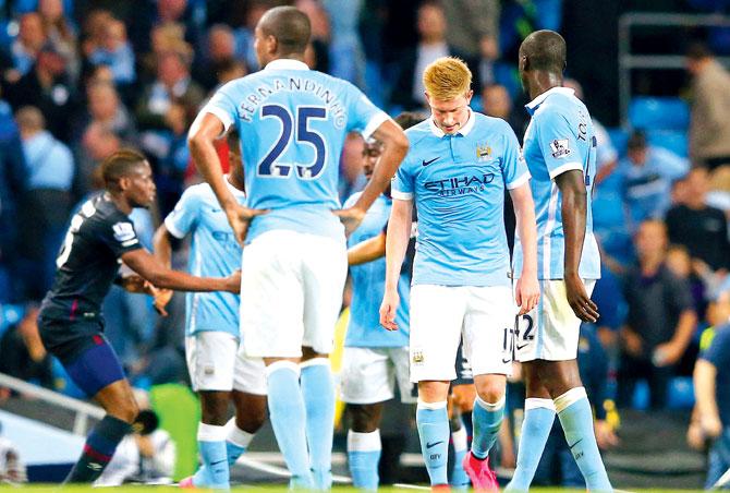 Kevin de Bruyne (centre) reacts after Manchester City
