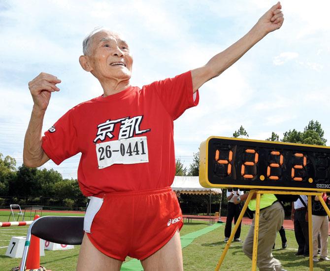Hidekichi Miyazaki celebrates his 100m win by striking Usain Bolt’s famous 