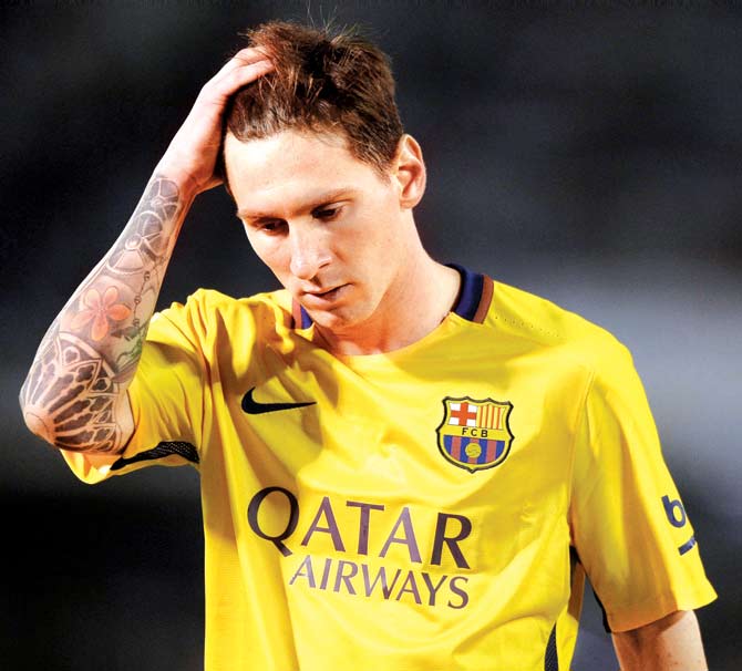 Lionel Messi reacts to Barcelona