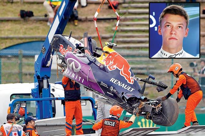 Red Bull driver Daniil Kvyat’s car is moved onto a truck after his crash in the qualifying session at the Japanese Grand Prix in Suzuka on Saturday. Inset: Daniil Kvyat. PICs/AFP & getty images