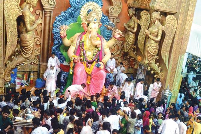 Residents who live in the vicinity of the Lalbaugcha Raja pandal are handed a Resident’s Pass that allows them to access a road that runs right by the pandal