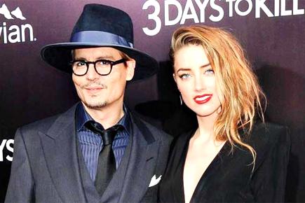 Amber Heard left in tears on charity outing with Johnny Depp