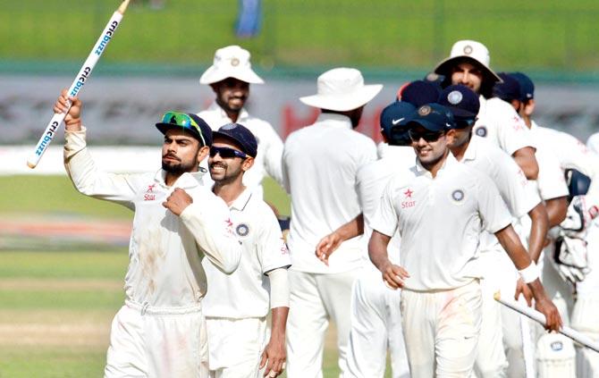 Virat Kohli and his teammates celebrate winning the final Test against Sri Lanka in Colombo yesterday. Pic/Solaris Images