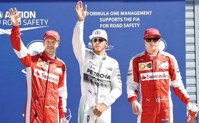 Mercedes- reigning Formula One champion and pole position winner for Sunday-s Italian GP Lewis Hamilton with third-placed Sebastian Vettel left and second-placed  Kimi Raikkonen, both from Ferrari, after the qualifying session at the Autodromo Nazionale Circuit in Monza, Italy on Saturday. Pic/AFP