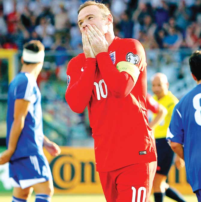 England skipper Wayne Rooney celebrates scoring the opening goal against San Marino on Saturday. Pic/Getty Images