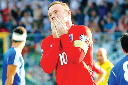 Rooney equals Charlton's record; England book Euro 2016 berth