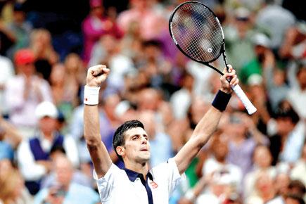 Night rider: Serbias World No 1 Novak Djokovic celebrates his win over Spains Roberto Bautista Agut in the mens singles pre-quarterfinal at the Billie Jean King National Tennis Center in New York on Sunday night. Djoko next plays Feliciano Lopez in the qu