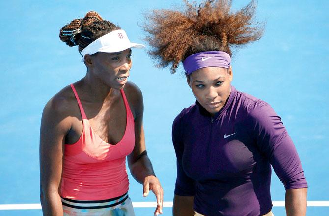 Venus Williams (left) with sister Serena during the Australian Open at Melbourne in January. Pic/Getty Images