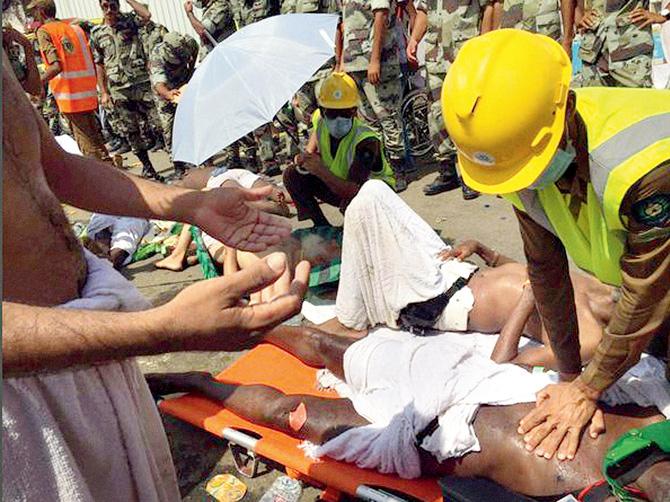 A pilgrim is treated by a medic after the stampede. Pic/pti 