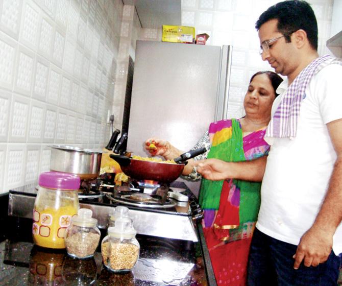 Chef Anees Khan cooking with his mother, Rashida Ali Khan in their home kitchen in Orissa