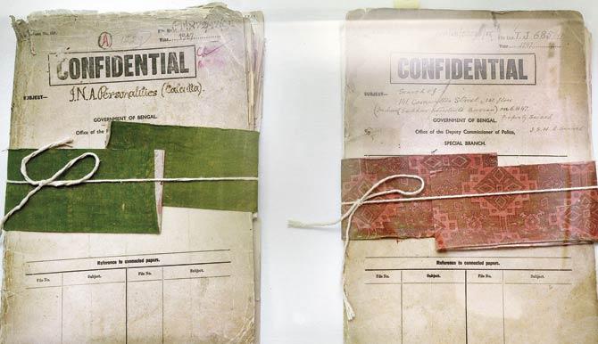 Two of the 64 declassified files on display. Pic/AFP
