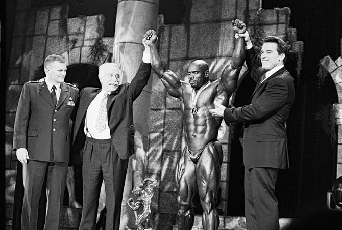Arnold Schwarzenegger, Flex Wheeler and former bodybuilder and entrepreneur Joe Weider seen in an archival image.