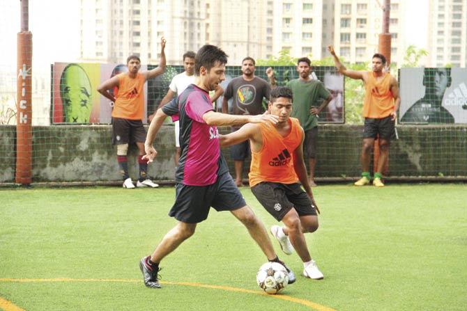 A football game in progress at Kick, Powai