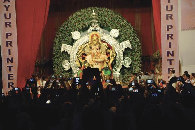 Devotees at the pandal of the GSB Mandal last year. The amount of gold on the idol itself is valued at above Rs 20 crore