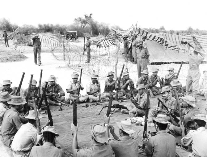 Fifty years ago: A 1965 picture of jawans cleaning their weapons during the Indo-Pak war. File pic/Getty Images