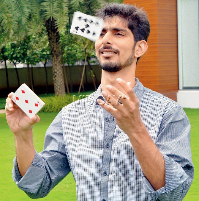 Magician Azhar Pirani, one half of the duo Urban Shama, with a deck of cards that he keeps handy