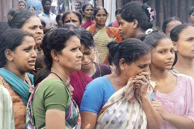This file pic shows the mourning relatives of the victims. The Malwani hooch tragedy claimed lives of 106 people, while another 75 were hospitalised after consuming adulterated alcohol